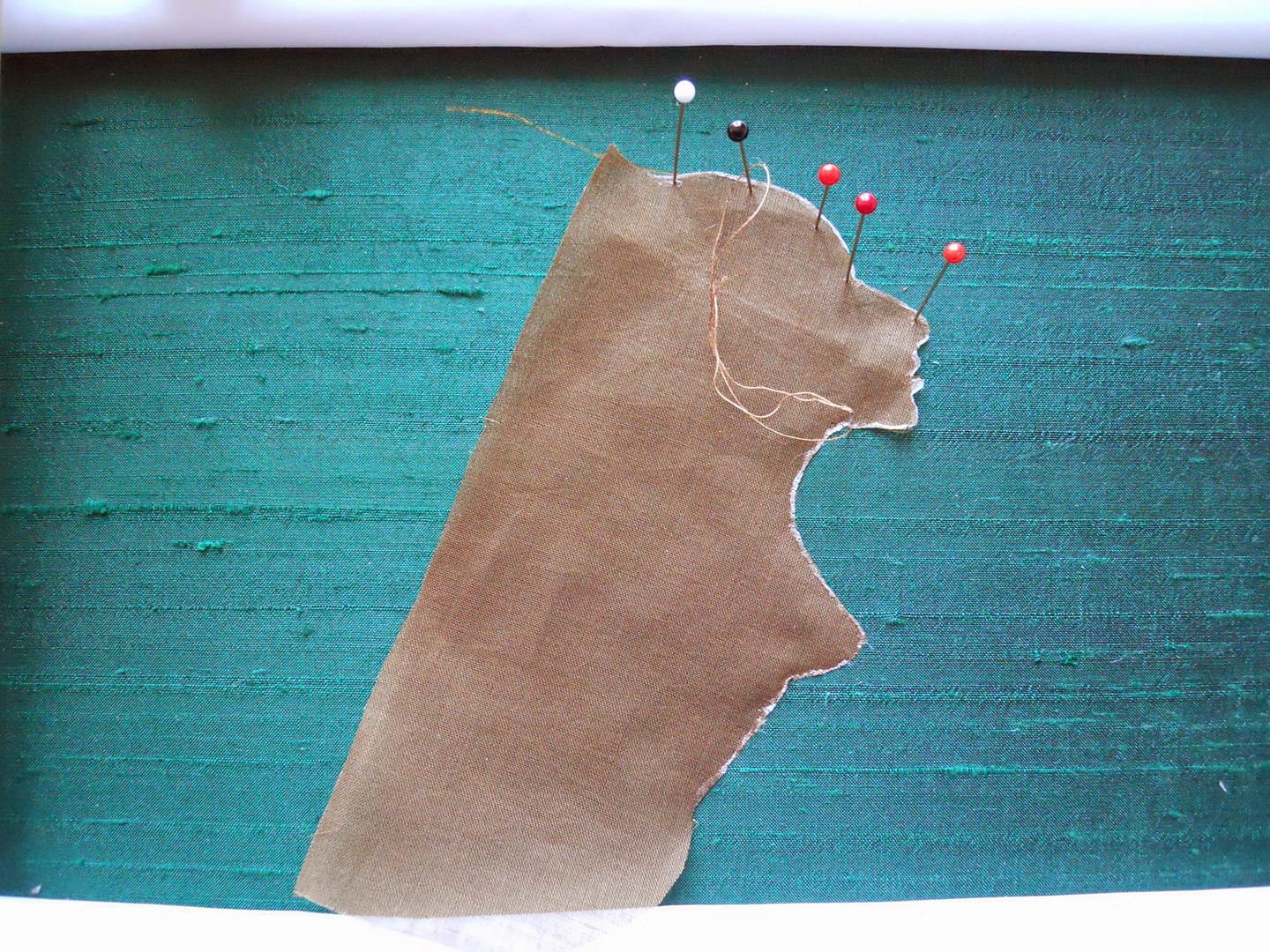 Applying the first textile layer to Lion Woman