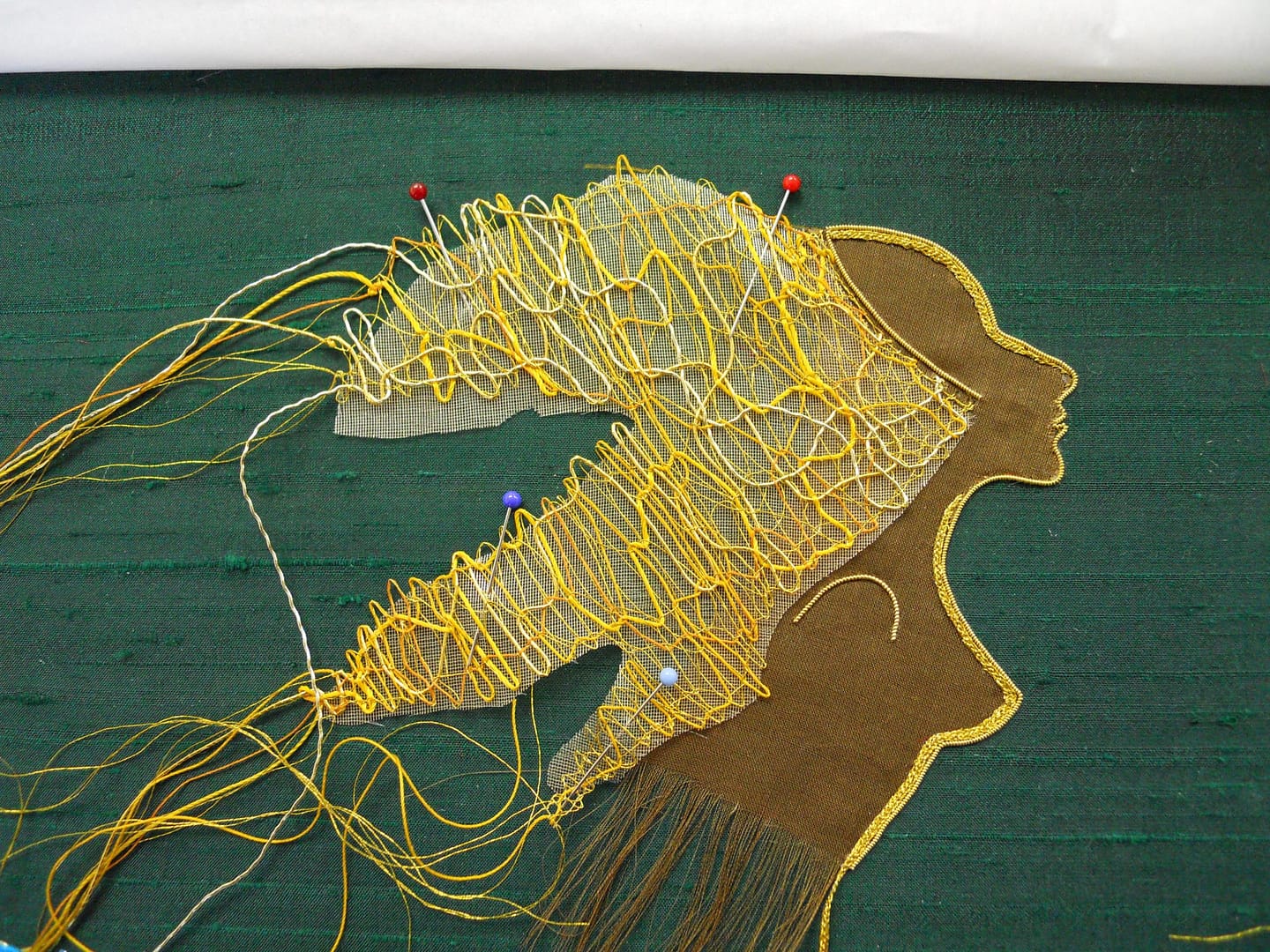 Placing lace mane on Lion Woman's head