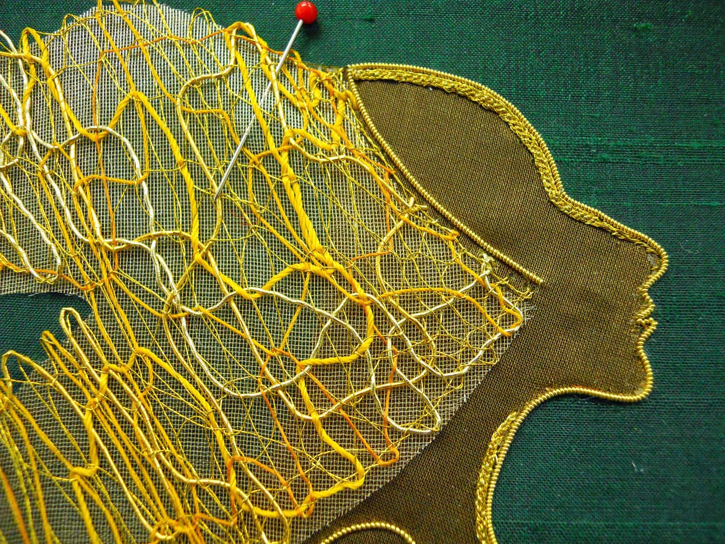 Placing the lace on the embroidered Lion Woman