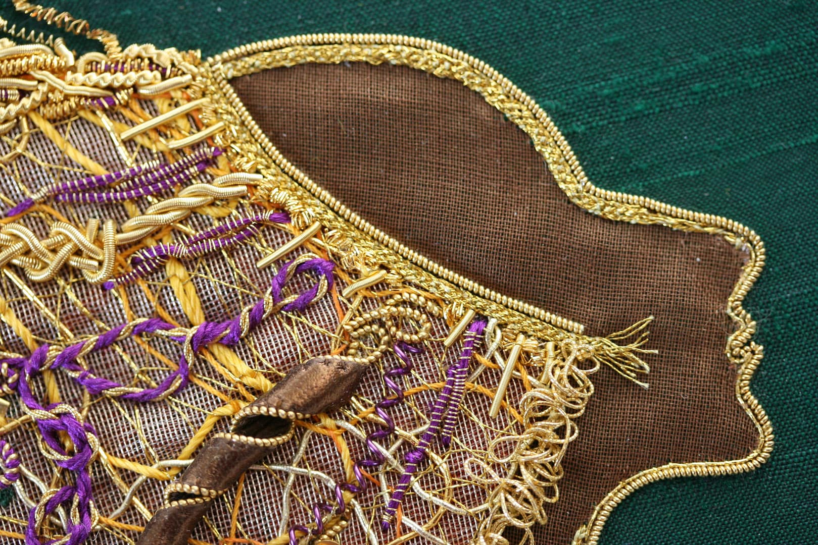 Details of Lion Woman: pleated gold threads