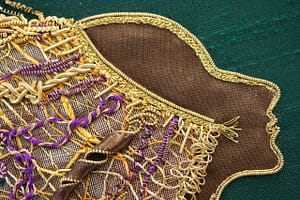 Details of Lion Woman: pleated gold threads