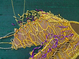 Adding coloured and gold purls to the top of the mane