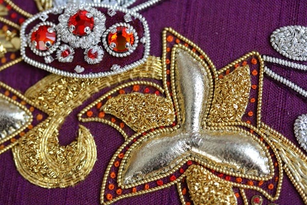 MEdallion with glass beads, leather gold kid with chipping