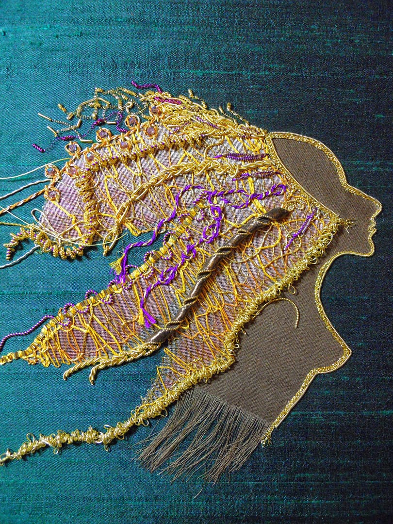 Lion Woman's mane is filled with contemporary goldthreads